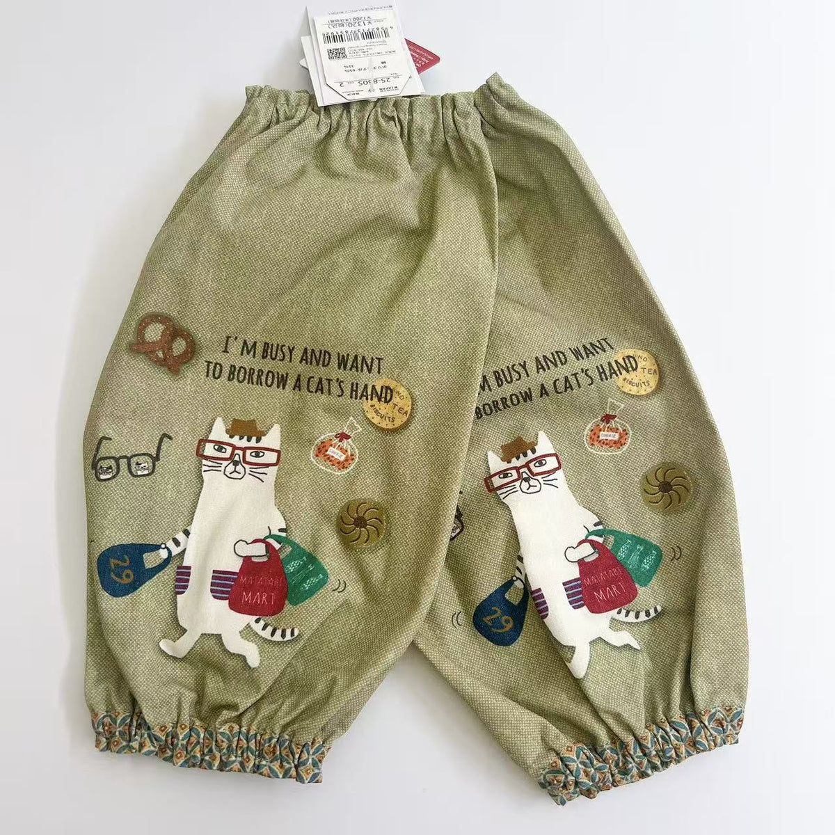 日本Kusuguru正品貓咪印花袖套家務防油防污袖套帆布花藝烘焙400｜眼鏡貓米黃8505-2