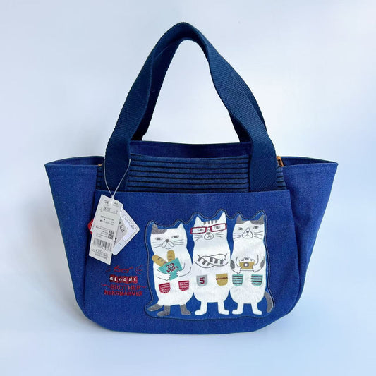 日本Kusuguru正品刺繡貓咪法鬥手提包手提包元寶包飯盒包帆布455｜眼鏡貓深藍455-2