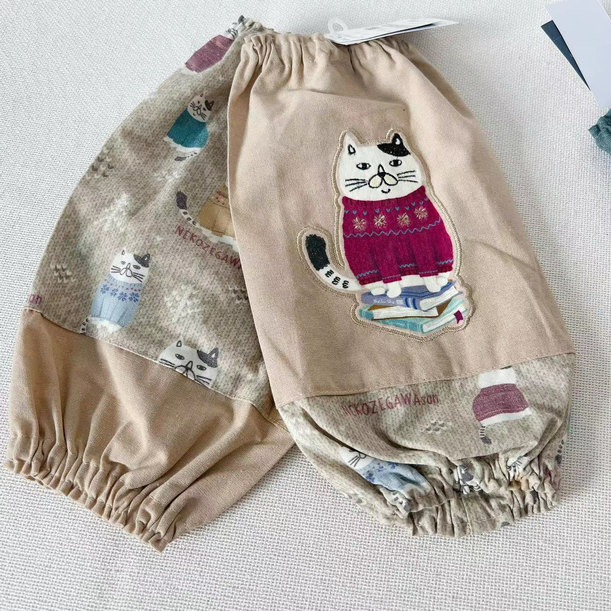 日本kusuguru刺繡胖貓袖套家務防油防污袖套卡通布藝烘焙花藝961｜米黃色6528-1／單一尺寸