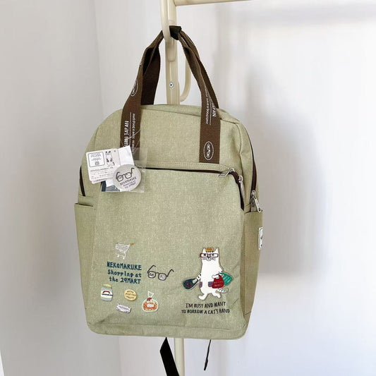 日本Kusuguru正品刺繡貓咪後背包手提包旅行背包媽咪包帆布包400｜眼鏡貓米黃8515-2